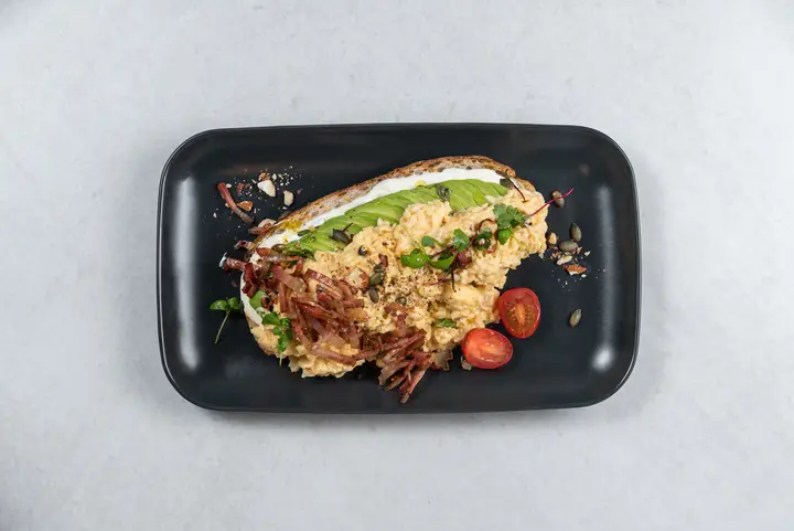 Avocado toast with bacon and cherry tomatoes
