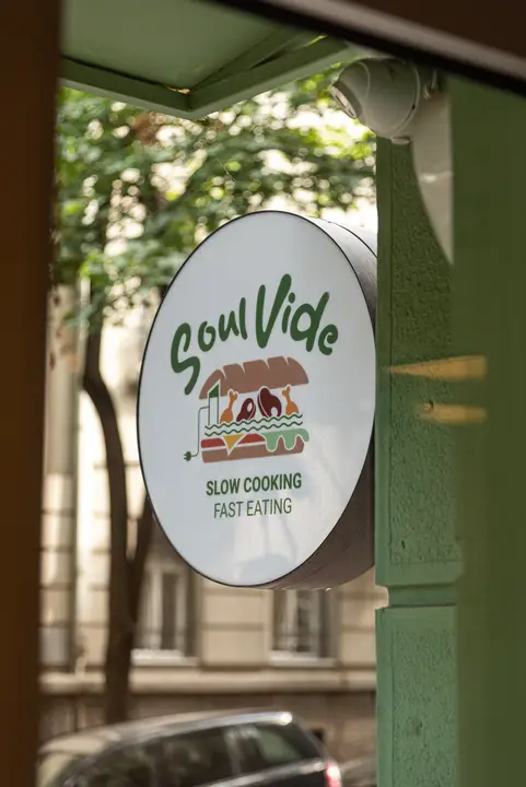Round green Soul Vide sign on the building